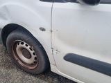 a white van that is parked on the side of the road