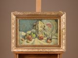 a picture of a painting on a easel with apples on it