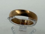 an image of a gold and silver ring on a clear surface
