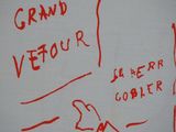 drawing of a person holding a sign that says grand vefour