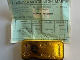 a small piece of gold on a piece of paper