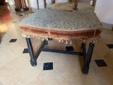 a chair that has a blanket on top of it