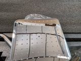 a metal tray that is sitting on the floor next to a mirror