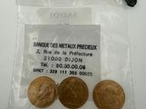 a close up of three coins in a bag on a table