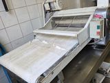 a machine that is sitting in a kitchen with a lot of counter space
