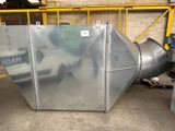 a large metal object that is sitting in a warehouse