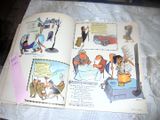 an open book with pictures of people and animals on it