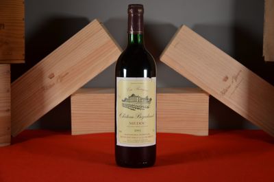 a bottle of wine that is sitting on a table