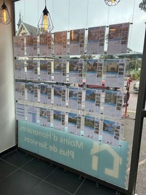 a large window with a picture of a house on it