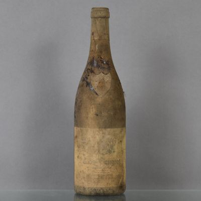 a bottle of wine that is sitting on a table