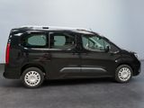 a picture of a black van parked in a room