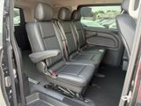 four seats in the back of a van that is empty