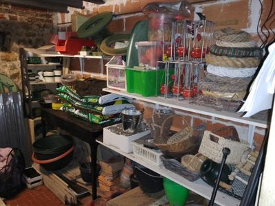a room that has a bunch of items on the shelves