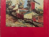 un livre rouge sur lequel figure l'image d'un moulin à vent