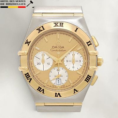 an image of a gold and silver watch with roman numerals
