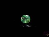a green tourmaline gems on a black background