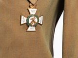 a close up of a military uniform with a cross on it