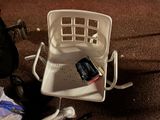a chair that has a toothbrush and a toothpaste in it