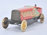 a small toy car that is sitting on a white surface
