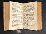an open book that is sitting on a table