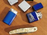 several lighters, lighters, lighter lighters and lighter lighters on a table