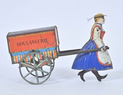 a toy of a woman pulling a cart with a bird on it