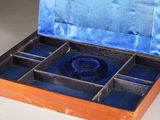 a box with a ring inside of it on a table