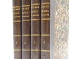 three books are stacked on top of each other on a white surface