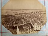 an old photo of a view of a city from the top of a building