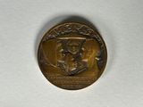 une image représentant une médaille d'or sur laquelle figurent une femme et un homme