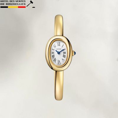 une photo d'une montre-bracelet pour femme avec un bracelet en or