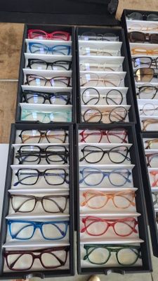 many pairs of glasses that are in a drawer