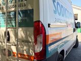a van that is parked on the side of the road