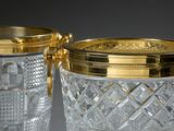two glasses that are sitting next to each other