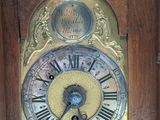 a clock with roman numerals on the face of it