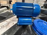 an image of a blue electric motor on top of a table