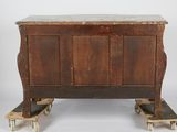 a wooden chest with a marble top on wheels