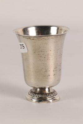 silver plated cup on pedestal with a price tag on the side