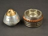 two metal objects that are sitting on a table