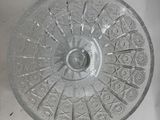 a glass plate with a pattern on it sitting on a table