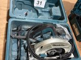 a box with a circular saw and a circular saw blade