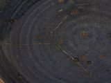 a close up of a blue bowl on a table