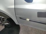 a close up of a car door with the door handle missing