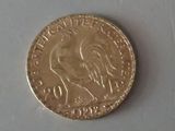 an old coin sitting on top of a table next to a white surface