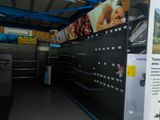 a lot of lockers in a store with signs on them