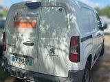 a white van that is parked on the side of the road