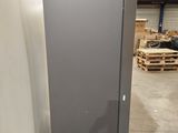 a refrigerator that is sitting on a pallet in a warehouse