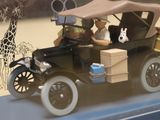 a model of a car with people and animals in it