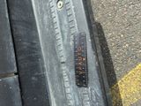 a close up of a car tire with a ruler on it