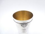 an image of a silver cup with a design on it
